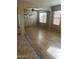 Bright living room featuring hardwood floors and an arched entryway at 18527 W Caribbean Ln, Surprise, AZ 85388