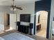 Main bedroom with large bed and ensuite bathroom access at 18527 W Caribbean Ln, Surprise, AZ 85388