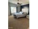 Spacious main bedroom with large bed and ensuite bathroom access at 18527 W Caribbean Ln, Surprise, AZ 85388