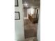 Upstairs hallway with wooden railing and carpeted flooring at 18527 W Caribbean Ln, Surprise, AZ 85388