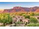Luxury homes with terracotta roofs nestled in a scenic mountain community at 3129 S Honeysuckle Ct, Gold Canyon, AZ 85118