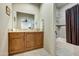 Elegant bathroom with double vanity, bathtub, and tiled shower at 3129 S Honeysuckle Ct, Gold Canyon, AZ 85118