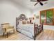 Bright bedroom with wood flooring and a comfortable bed at 3129 S Honeysuckle Ct, Gold Canyon, AZ 85118