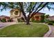Two story home with large tree and manicured lawn at 3129 S Honeysuckle Ct, Gold Canyon, AZ 85118