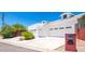 Three-car garage with white stucco exterior and gated driveway at 4350 E Vermont Ave, Phoenix, AZ 85018