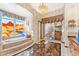 Bathroom with large soaking tub, stained glass windows, and tile floor at 34617 N Desert Ridge Dr, Scottsdale, AZ 85262
