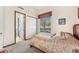 Bedroom with ensuite bathroom and window with desert views at 34617 N Desert Ridge Dr, Scottsdale, AZ 85262