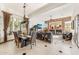 Dining room with large windows, wood floors, and view of the living room at 34617 N Desert Ridge Dr, Scottsdale, AZ 85262