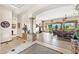 View from the foyer into living room showing tiled floors and columns at 34617 N Desert Ridge Dr, Scottsdale, AZ 85262