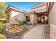 Front yard features stone walkway, fountain, and desert landscaping at 34617 N Desert Ridge Dr, Scottsdale, AZ 85262