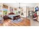 Main bedroom with wood flooring, ceiling fan, and view of the bathroom at 34617 N Desert Ridge Dr, Scottsdale, AZ 85262