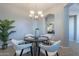 Bright dining area with a four-person table and modern chandelier at 4777 S Fulton Ranch Blvd # 2071, Chandler, AZ 85248