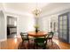 Charming dining room with hardwood floors and access to the patio at 1547 W Vernon Ave, Phoenix, AZ 85007