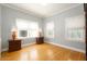 Bright bedroom with hardwood floors and ample natural light at 1547 W Vernon Ave, Phoenix, AZ 85007