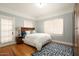 Bedroom with hardwood floors, and access to the outdoors at 1547 W Vernon Ave, Phoenix, AZ 85007