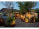 Landscaped backyard with pathway and lighting at 1547 W Vernon Ave, Phoenix, AZ 85007