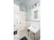 Bathroom with pedestal sink, tiled floor and built-in cabinetry at 1547 W Vernon Ave, Phoenix, AZ 85007