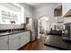 Modern kitchen featuring stainless steel appliances and dark countertops at 1547 W Vernon Ave, Phoenix, AZ 85007