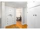 Hallway with built-in storage and hardwood floors at 1547 W Vernon Ave, Phoenix, AZ 85007