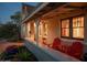 Inviting front porch with red chairs, perfect for relaxing evenings at 1547 W Vernon Ave, Phoenix, AZ 85007