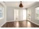 Bedroom with hardwood floors and access to a bathroom and backyard at 1547 W Vernon Ave, Phoenix, AZ 85007