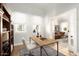 Home office featuring a large desk and built-in shelving at 1547 W Vernon Ave, Phoenix, AZ 85007