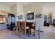 Elegant wet bar with seating for three and wine storage at 34617 N Desert Ridge Dr, Scottsdale, AZ 85262