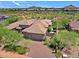 Luxury home with tile roof, large driveway, and desert landscaping at 34617 N Desert Ridge Dr, Scottsdale, AZ 85262