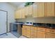 Laundry room with washer, dryer, and ample cabinet space at 34617 N Desert Ridge Dr, Scottsdale, AZ 85262