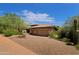 Beautiful two-story home with a brick driveway and desert landscaping at 34617 N Desert Ridge Dr, Scottsdale, AZ 85262