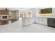 Modern kitchen with white cabinets and a breakfast bar at 9214 W Kerry Ln, Peoria, AZ 85382