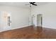 Spacious bedroom with hardwood floors and access to a private patio at 9214 W Kerry Ln, Peoria, AZ 85382