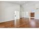 Open living area with hardwood floors and high ceilings at 9214 W Kerry Ln, Peoria, AZ 85382