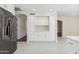 Modern kitchen with white cabinets, quartz countertops and stainless steel appliances at 9214 W Kerry Ln, Peoria, AZ 85382