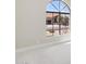 Bright living room with large arched window and view of the backyard at 9214 W Kerry Ln, Peoria, AZ 85382