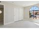 Bright bedroom with large arched window and double door closet at 9214 W Kerry Ln, Peoria, AZ 85382