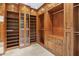 Large walk-in closet with wooden shelving and hanging space at 6324 N 48Th Pl, Paradise Valley, AZ 85253