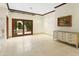 Bedroom with tiled floor, French doors to a private patio, and dresser at 6324 N 48Th Pl, Paradise Valley, AZ 85253