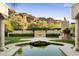Backyard oasis with fountain, fireplace, and reflecting pool at 6324 N 48Th Pl, Paradise Valley, AZ 85253