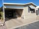 Tan mobile home with carport and golf cart at 17200 W Bell Rd # 1637, Surprise, AZ 85374