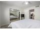 Spacious bedroom with a large bed and mirrored closet at 19820 N 13Th Ave # 226, Phoenix, AZ 85027