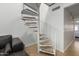 Modern white spiral staircase leading to the upper level at 19820 N 13Th Ave # 226, Phoenix, AZ 85027