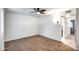 Spacious bedroom with ceiling fan and carpet flooring at 19202 N Signal Butte Cir, Sun City, AZ 85373