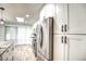 Modern kitchen features stainless steel appliances and white cabinets at 19202 N Signal Butte Cir, Sun City, AZ 85373