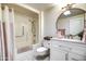 Bathroom with tub shower and updated vanity at 19202 N Signal Butte Cir, Sun City, AZ 85373