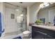 Updated bathroom with walk-in shower and modern vanity at 19202 N Signal Butte Cir, Sun City, AZ 85373