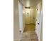 Clean and bright hallway with wood-look tile floor at 19202 N Signal Butte Cir, Sun City, AZ 85373