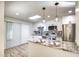 Updated kitchen features a granite island, stainless steel appliances, and white cabinetry at 19202 N Signal Butte Cir, Sun City, AZ 85373