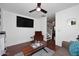 Living room with hardwood floors, a comfy armchair, and a staircase view at 4306 E Tyson St, Gilbert, AZ 85295