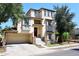 Three-story home with a two-car garage and stonework at 4306 E Tyson St, Gilbert, AZ 85295